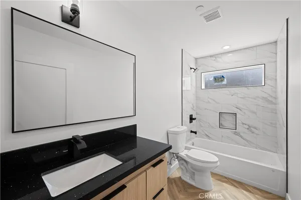 an empty room with wooden floor