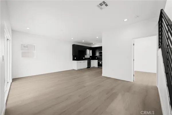 a view of a kitchen with a sink and a kitchen floor