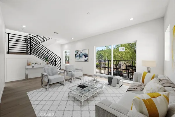 a view of a dining room with furniture wooden floor and windows