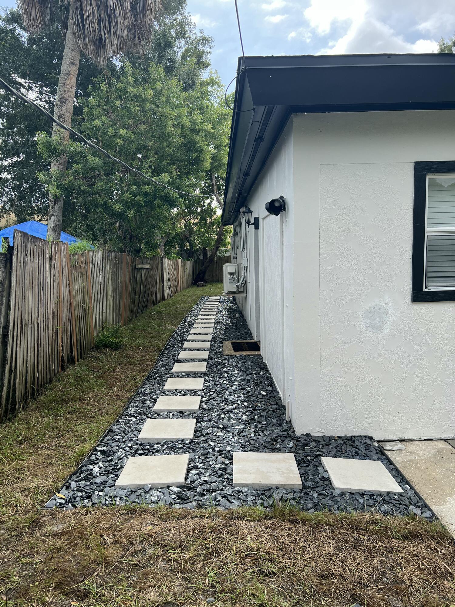 1016 Chipola Road, Unit B Fort Pierce, FL 34950 - Photo 2 of 17 a view of a backyard with pathway