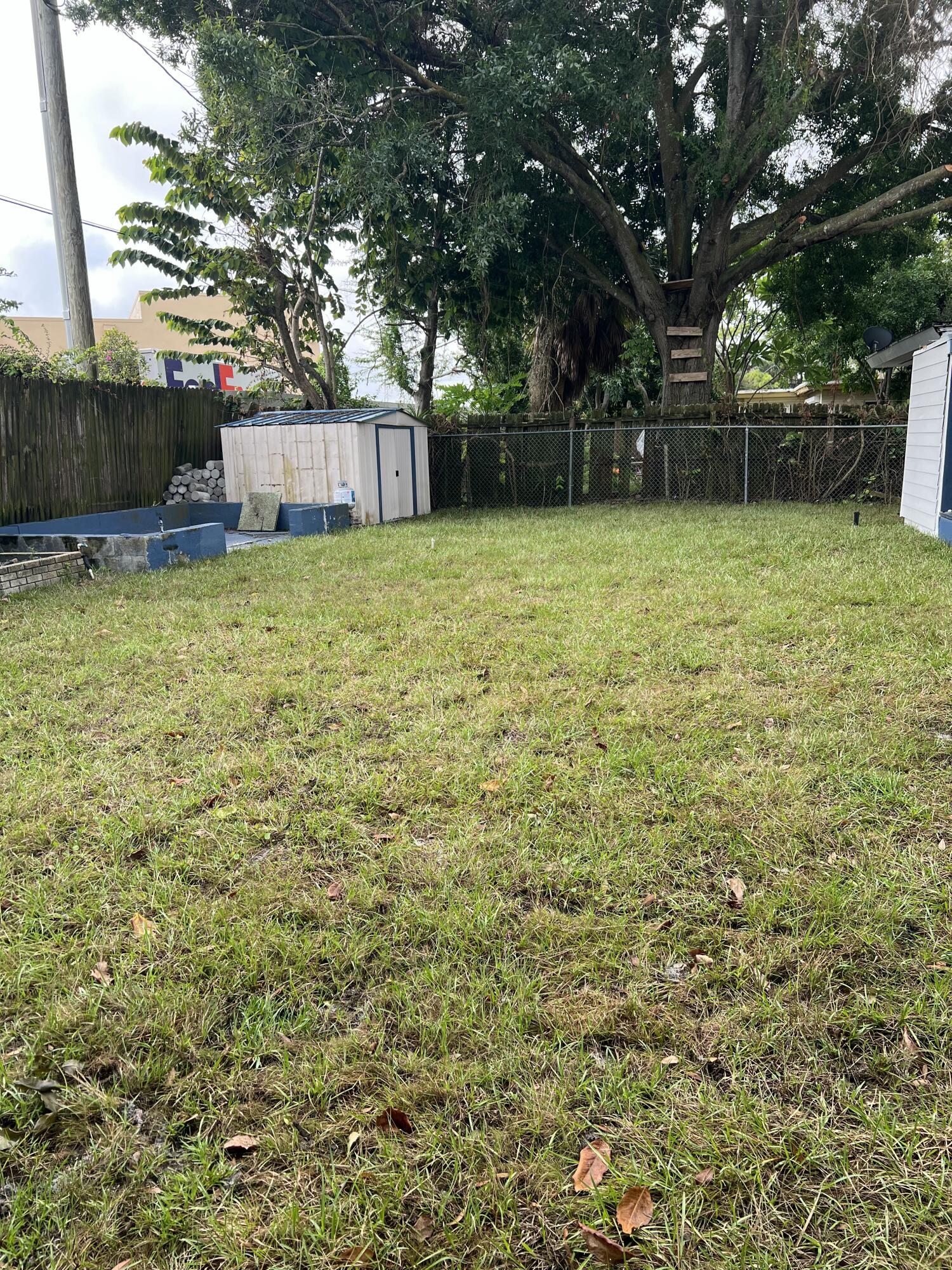 1016 Chipola Road, Unit B Fort Pierce, FL 34950 - Photo 3 of 17 a view of a backyard with a small cabin