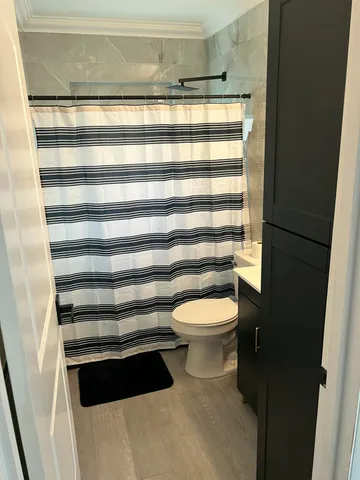 a bathroom with a toilet and a sink