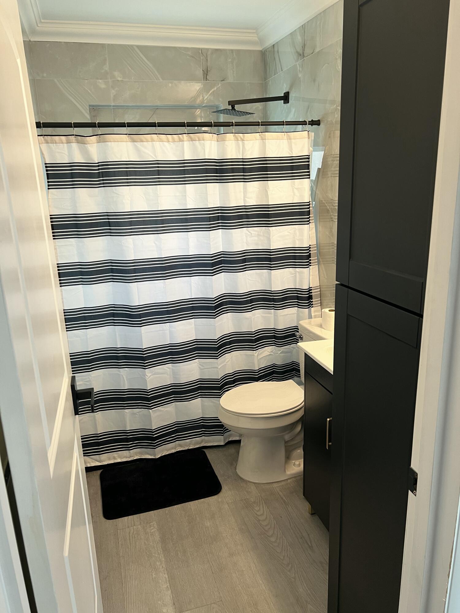 1016 Chipola Road, Unit B Fort Pierce, FL 34950 - Photo 10 of 17 a bathroom with a toilet and a sink