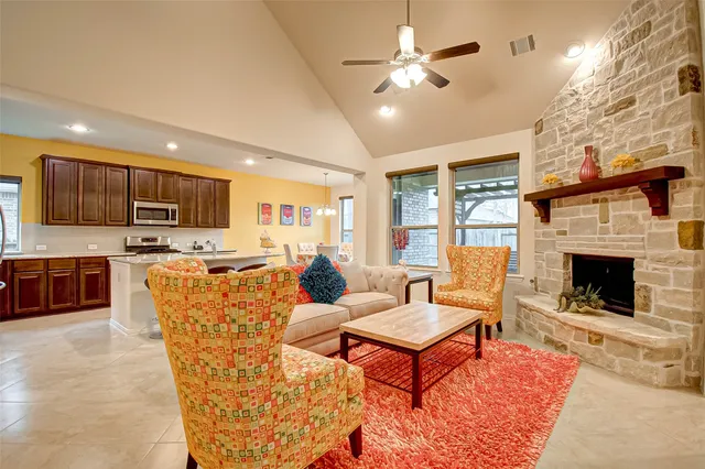 a living room with furniture and a fireplace