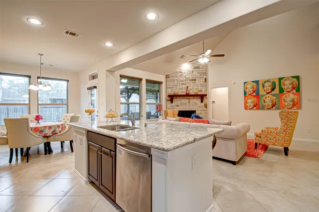 a room with furniture a clock and a view of living room