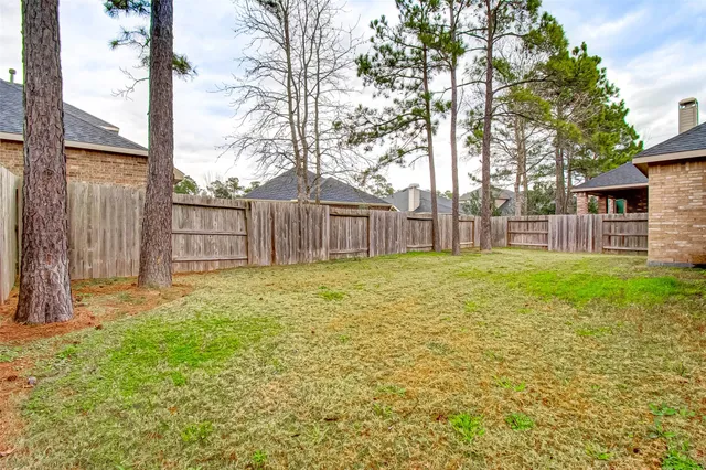 a backyard of a house with lots of green space