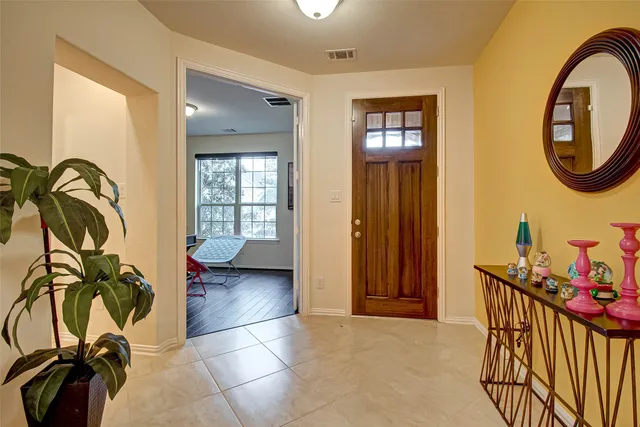 a view of a entryway door with wooden floor