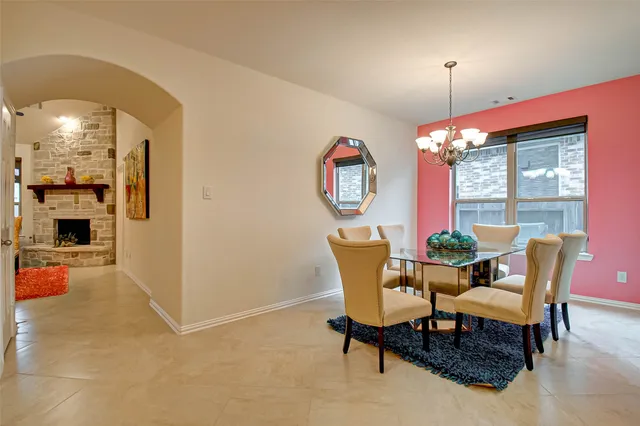 a dining room with furniture a livingroom and chandelier