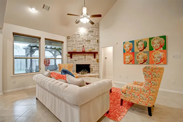 a living room with furniture and a fireplace