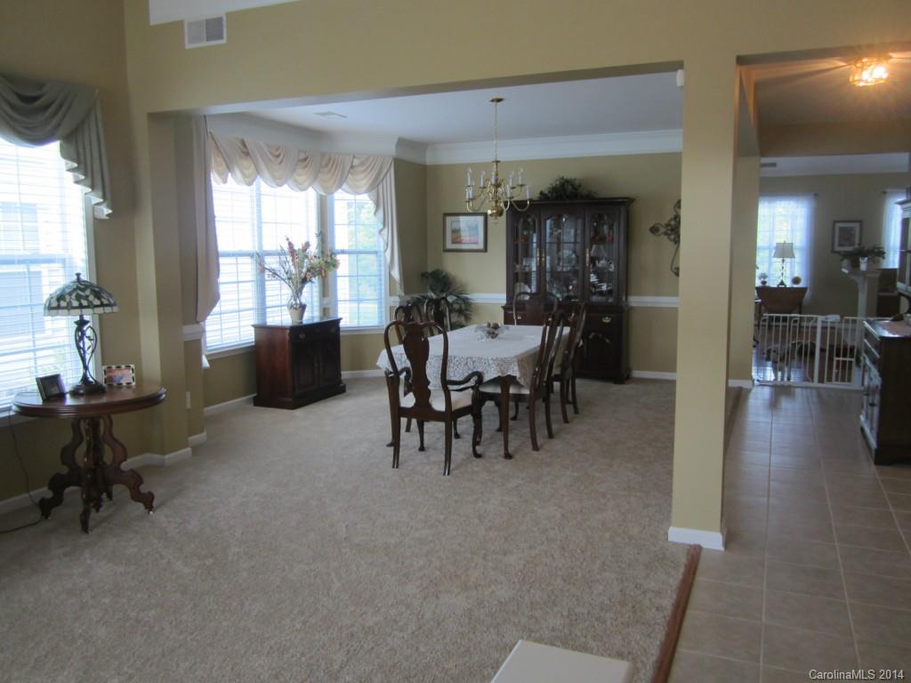 547 Turquoise Way Fort Mill, SC 29708 - Photo 2 of 12 a view of a dining area with furniture window and wooden floor
