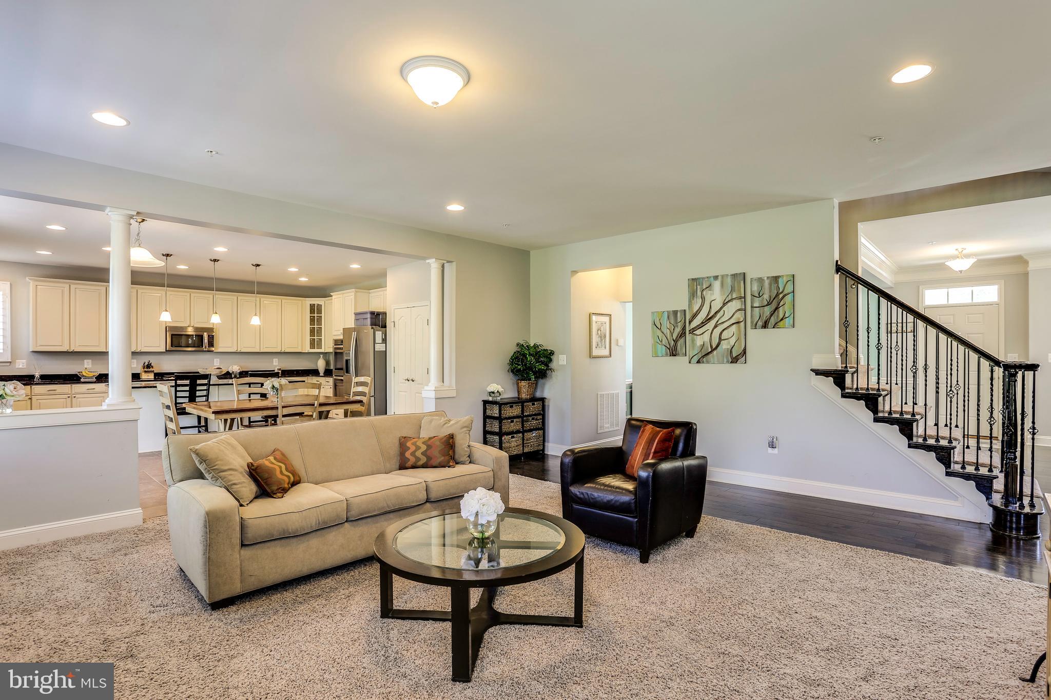 6721 Evanston Road Baltimore, MD 21209 - Photo 13 of 38 Large Family Room Leads to Gourmet Kitchen