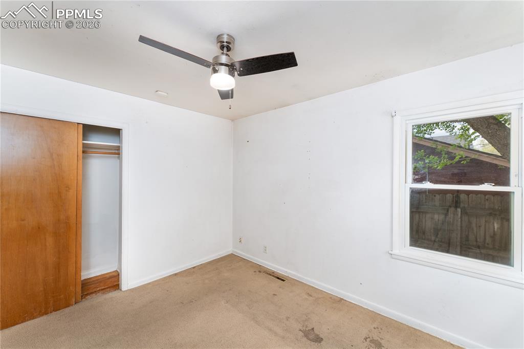 2818 Templeton Gap Road Colorado Springs, CO 80907 - Photo 13 of 27 an empty room with a window