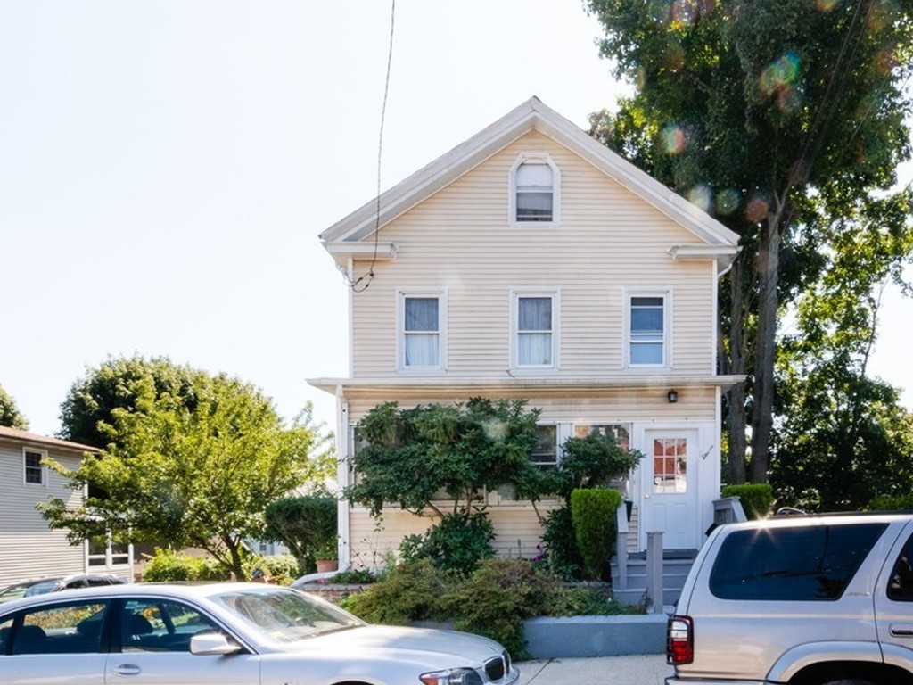 11 Rugdale Road Boston, MA 02124 - Photo 1 of 29 a view of a white house and a car parked in front of it