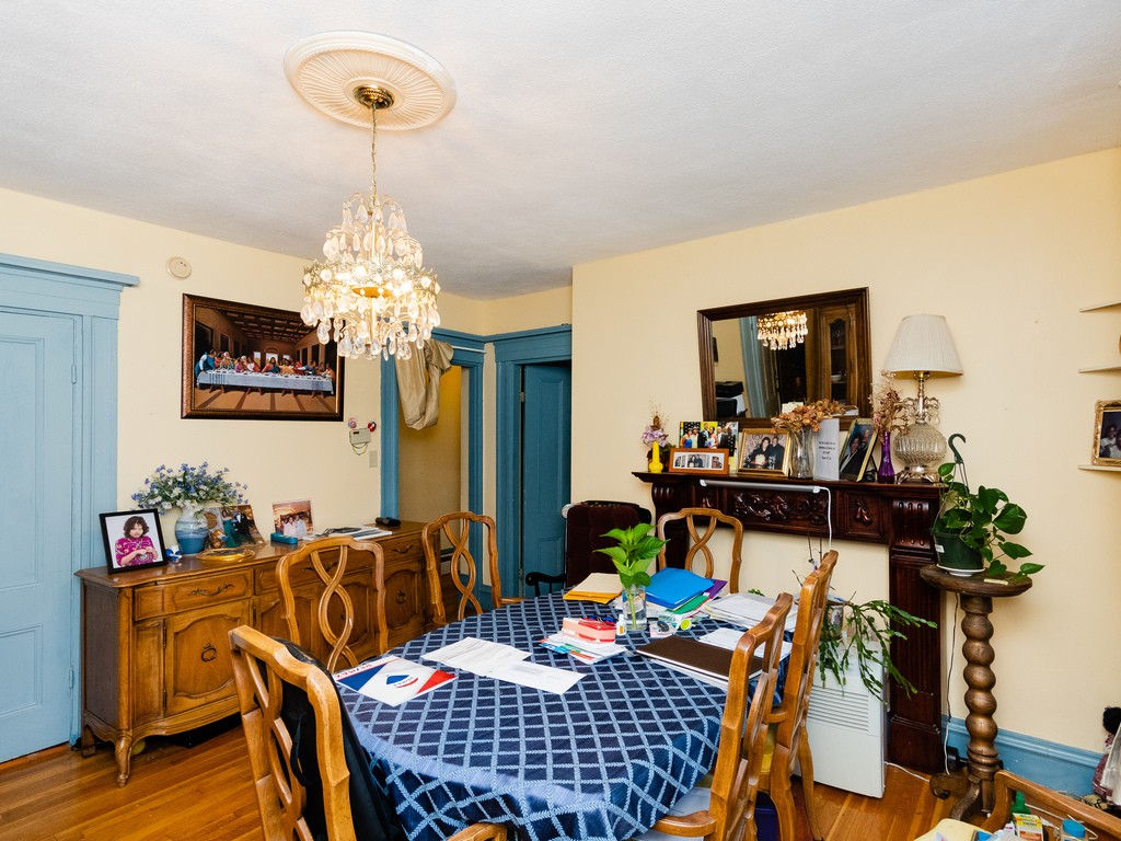 11 Rugdale Road Boston, MA 02124 - Photo 11 of 29 a view of a dining room with furniture and chandelier