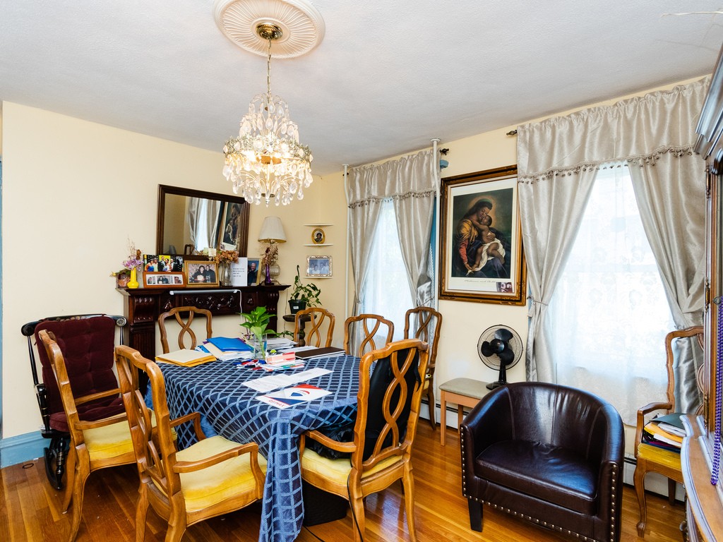 11 Rugdale Road Boston, MA 02124 - Photo 12 of 29 a view of a dining room with furniture and chandelier