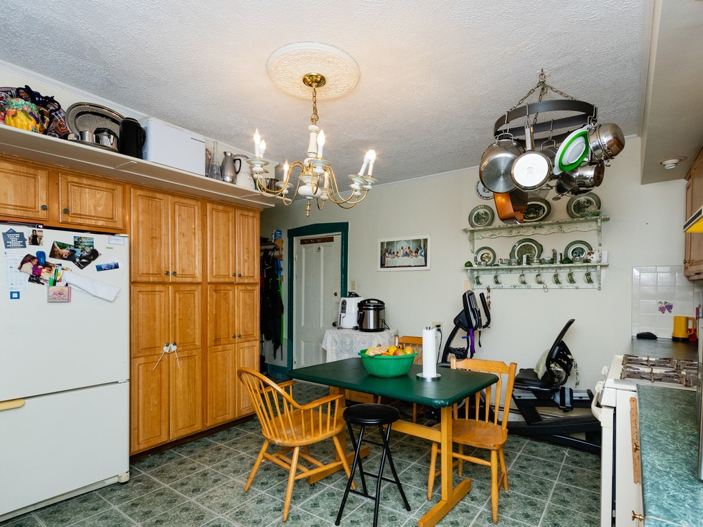 11 Rugdale Road Boston, MA 02124 - Photo 14 of 29 a view of a dining room with furniture and chandelier