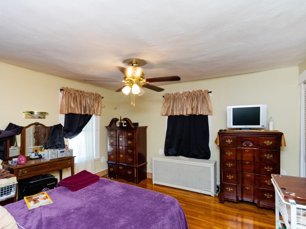 11 Rugdale Road Boston, MA 02124 - Photo 20 of 29 a living room with furniture and a flat screen tv