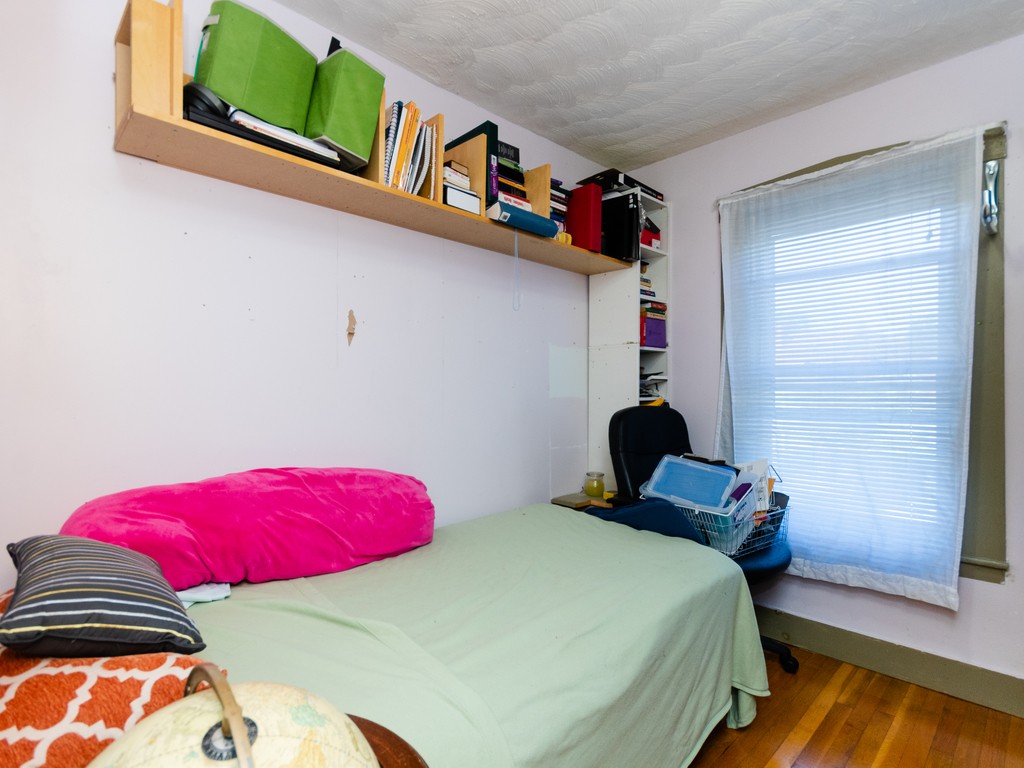 11 Rugdale Road Boston, MA 02124 - Photo 22 of 29 a bedroom with a bed and a window