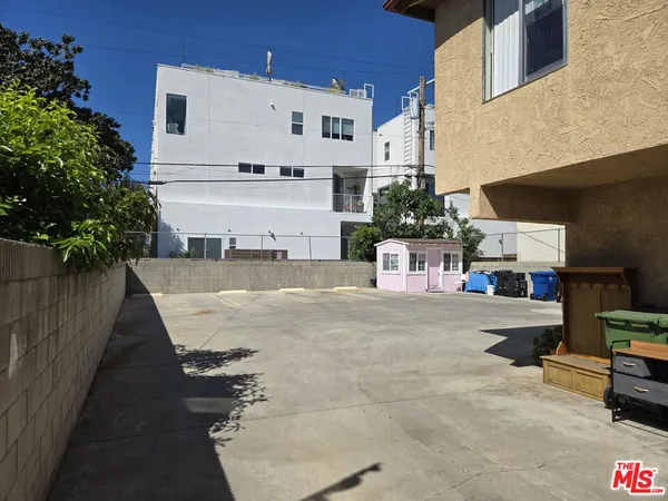 a view of multiple house with outdoor space and sitting area