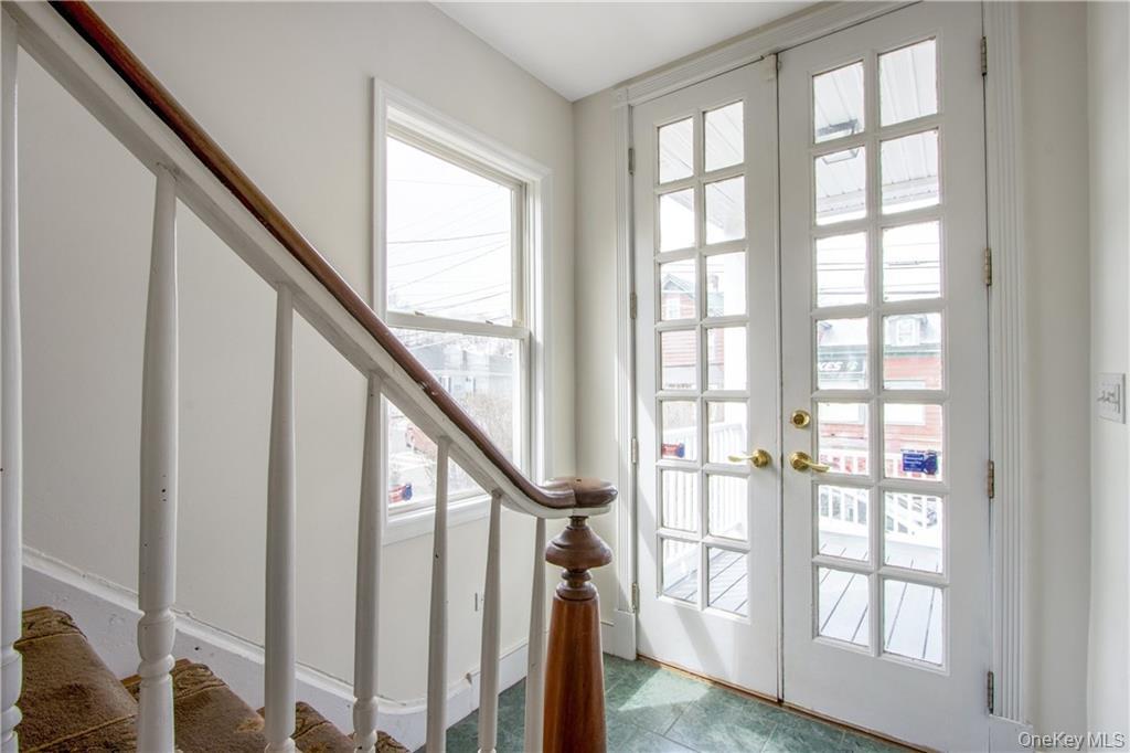241 Main Street, Unit 2 Cornwall, NY 12518 - Photo 2 of 12 a view of an entryway with wooden floor and windows