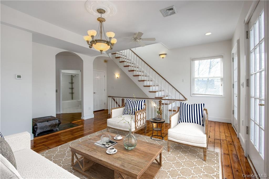 241 Main Street, Unit 2 Cornwall, NY 12518 - Photo 3 of 12 a living room with furniture and a chandelier