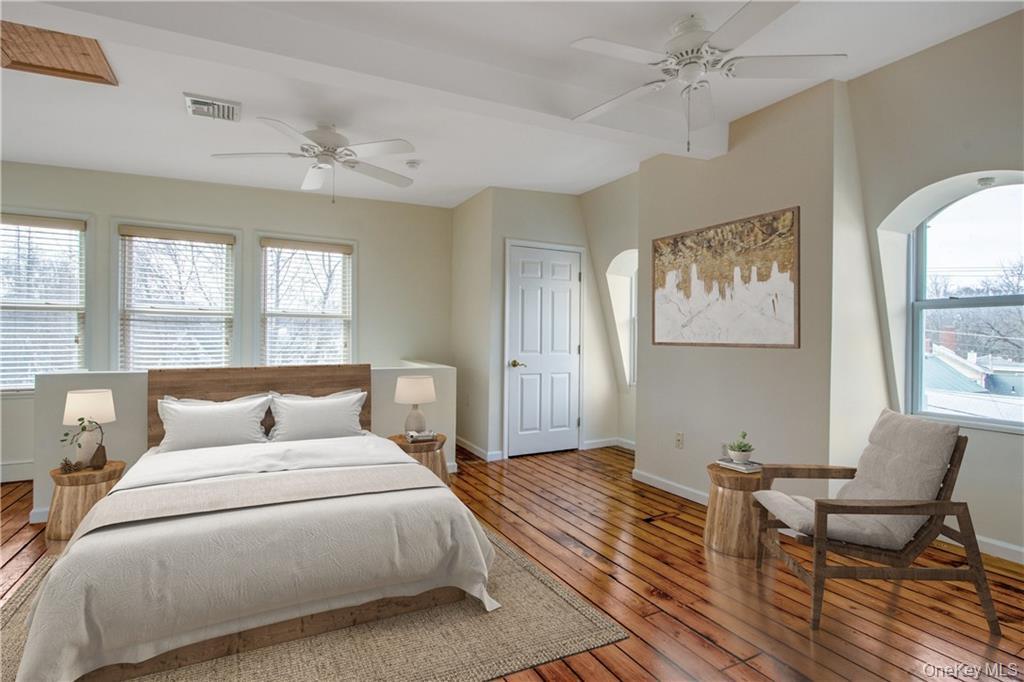 241 Main Street, Unit 2 Cornwall, NY 12518 - Photo 9 of 12 a bedroom with a bed and wooden floor