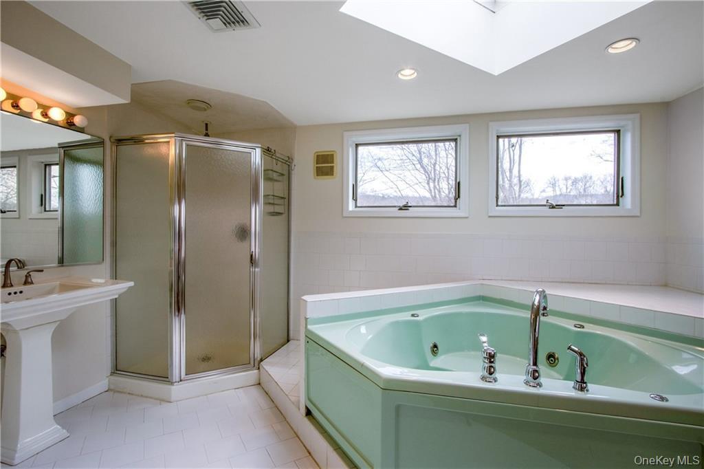 241 Main Street, Unit 2 Cornwall, NY 12518 - Photo 10 of 12 a bathroom with a bathtub and a sink