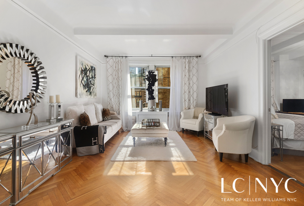 575 Park Avenue, Unit 1105 Manhattan, NY 10065 - Photo 3 of 18 a living room with furniture and a flat screen tv