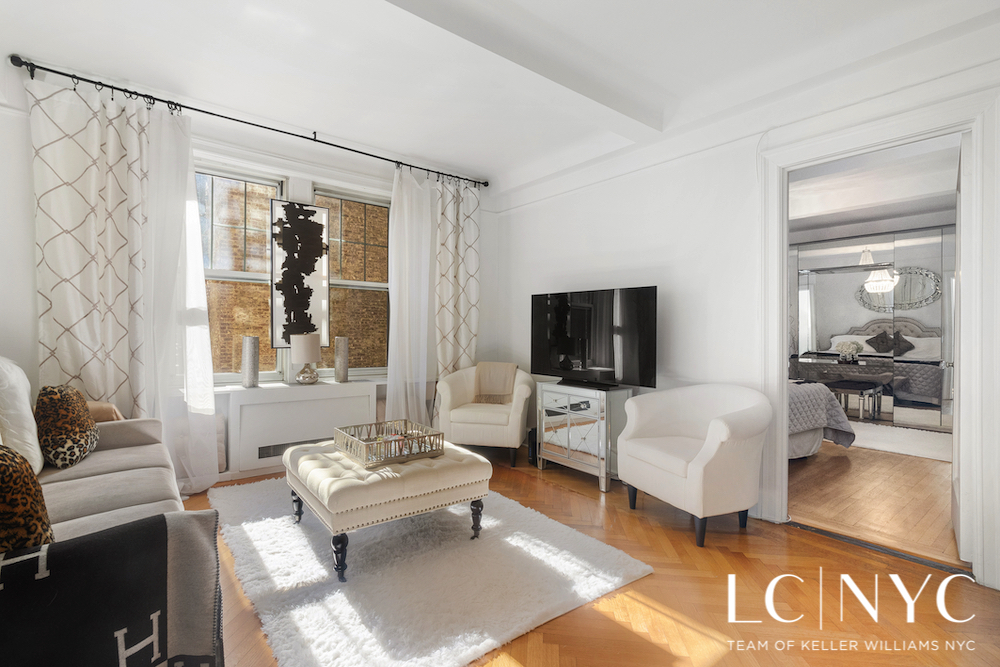 575 Park Avenue, Unit 1105 Manhattan, NY 10065 - Photo 4 of 18 a living room with furniture and a flat screen tv