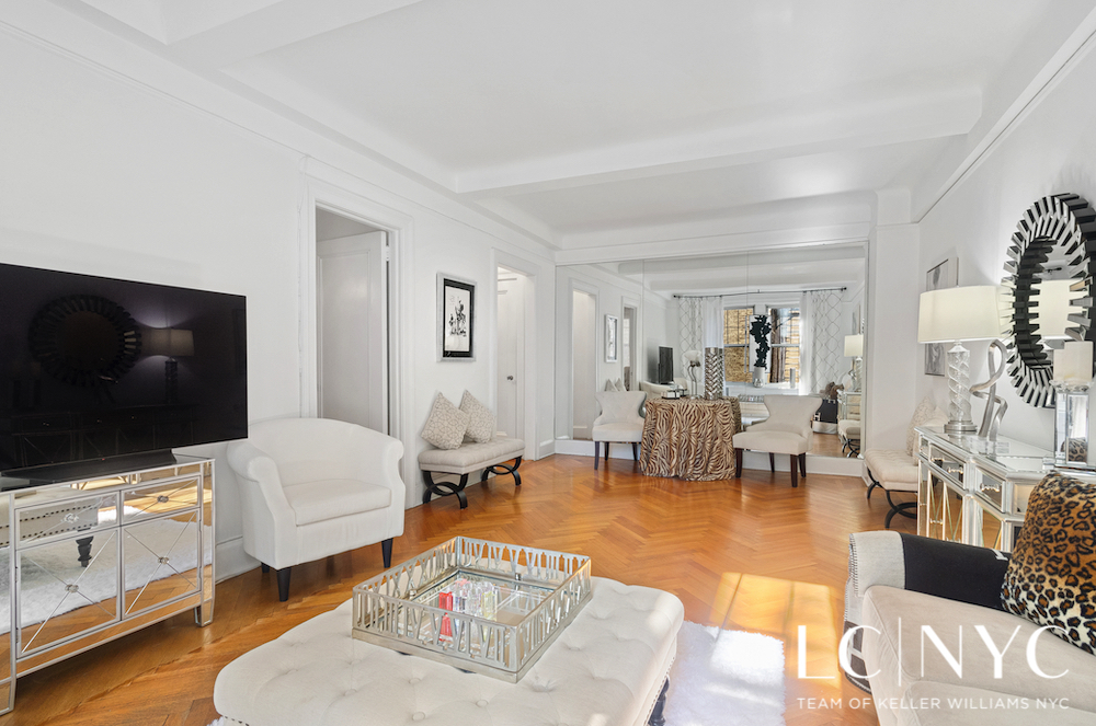 575 Park Avenue, Unit 1105 Manhattan, NY 10065 - Photo 5 of 18 a living room with furniture and a flat screen tv