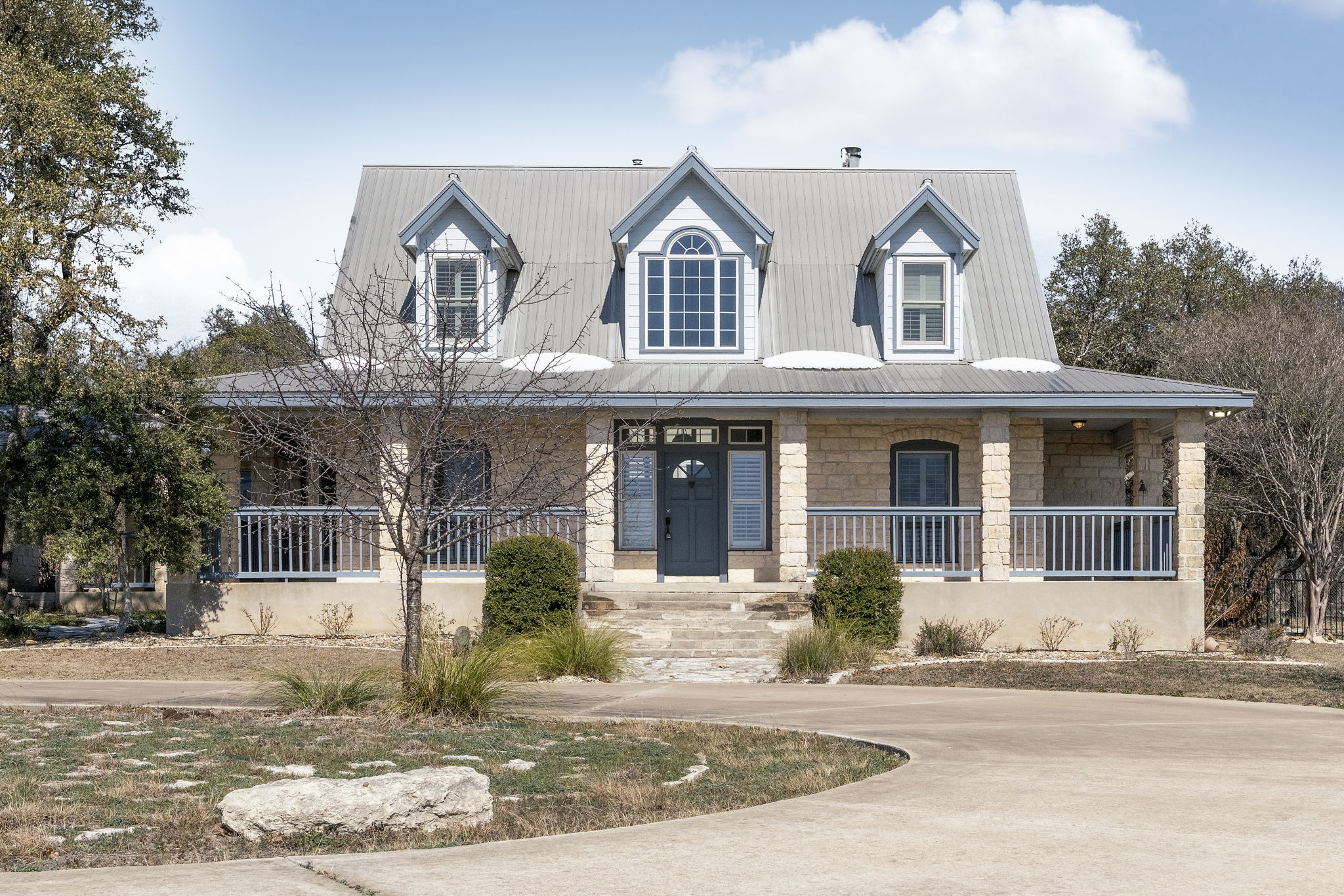310 County Road 317 Georgetown, TX 78626 - Photo 3 of 40 View of front facade with covered porch and stone siding