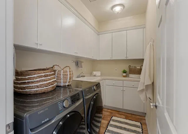 a kitchen with stainless steel appliances cabinets and a sink
