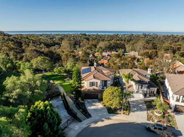 an aerial view of a house with a garden