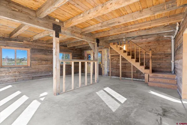 a view of an empty room with stairs