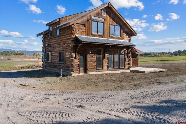 a front view of a house with a ocean view
