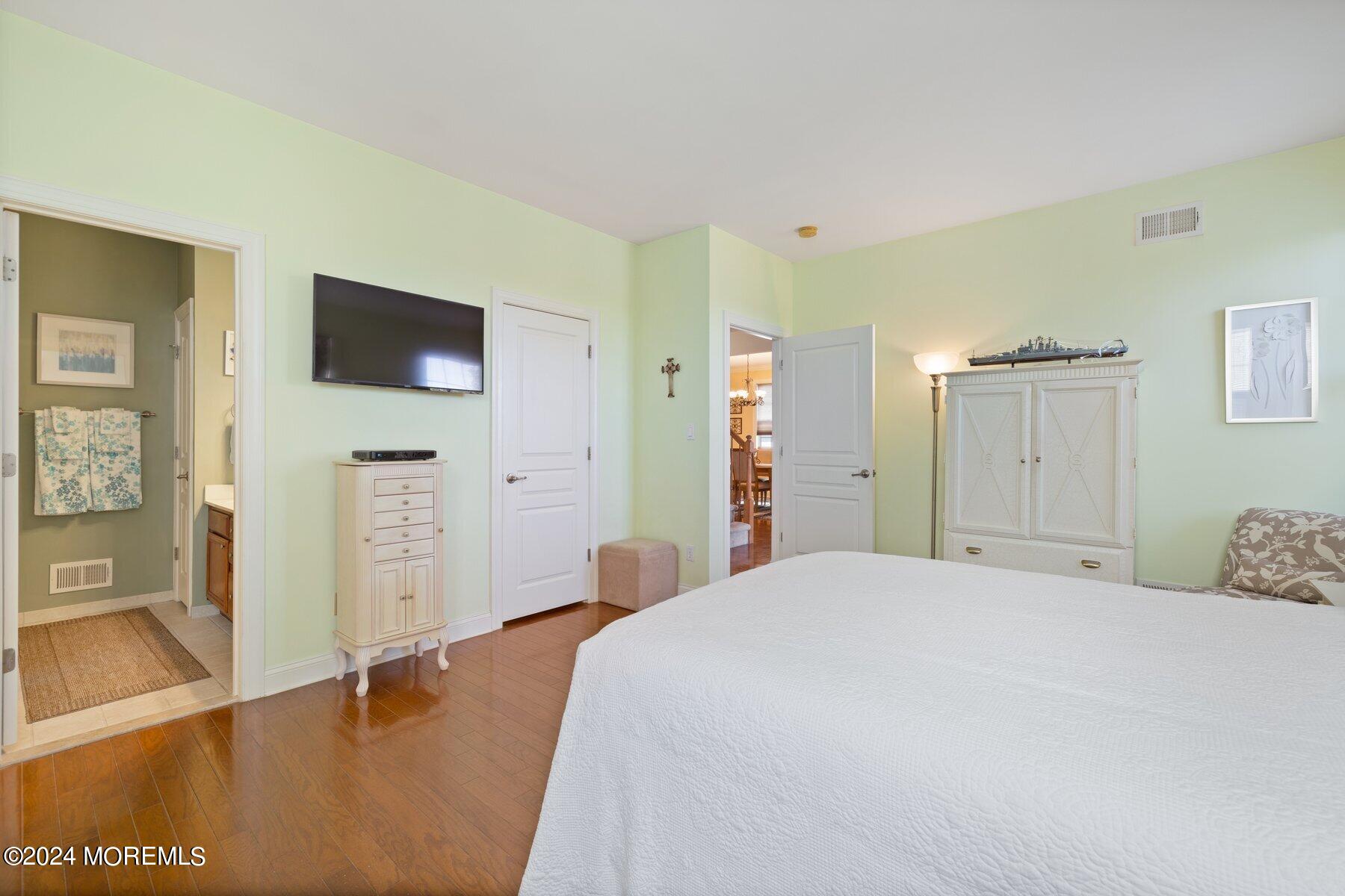 20 Silver Maple Lane Howell, NJ 07731 - Photo 17 of 35 a bedroom with a bed and a flat screen tv