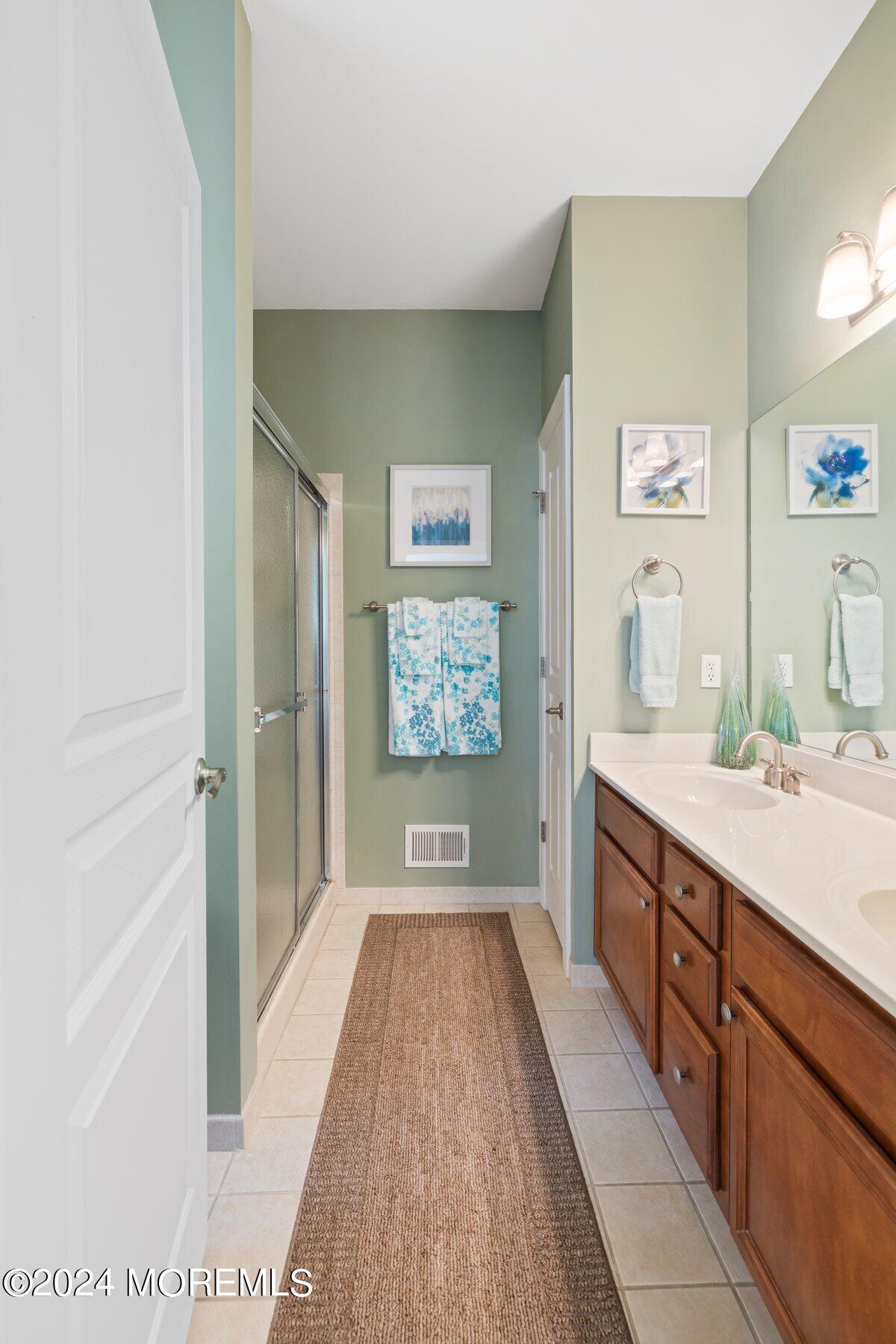20 Silver Maple Lane Howell, NJ 07731 - Photo 18 of 35 a bathroom with a sink a mirror and a bathtub