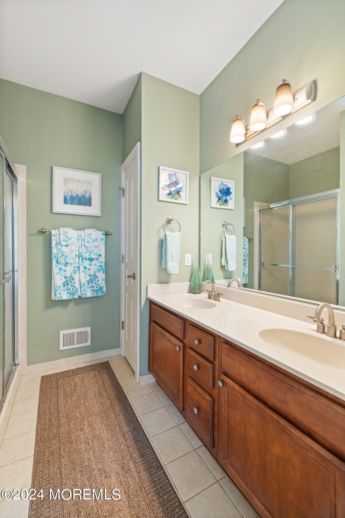 20 Silver Maple Lane Howell, NJ 07731 - Photo 19 of 35 a spacious bathroom with a sink a mirror and a shower
