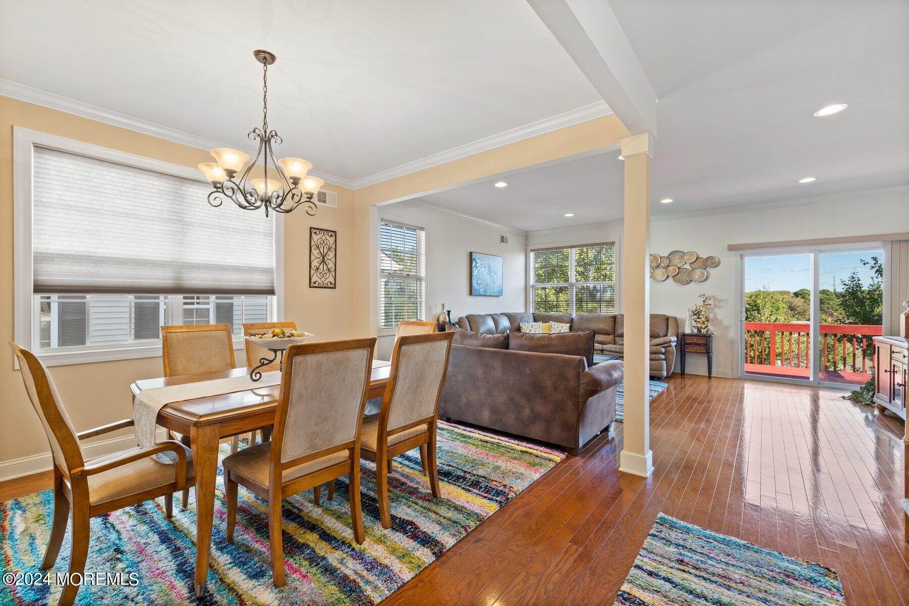20 Silver Maple Lane Howell, NJ 07731 - Photo 10 of 35 a view of a dining room with furniture wooden floor and chandelier