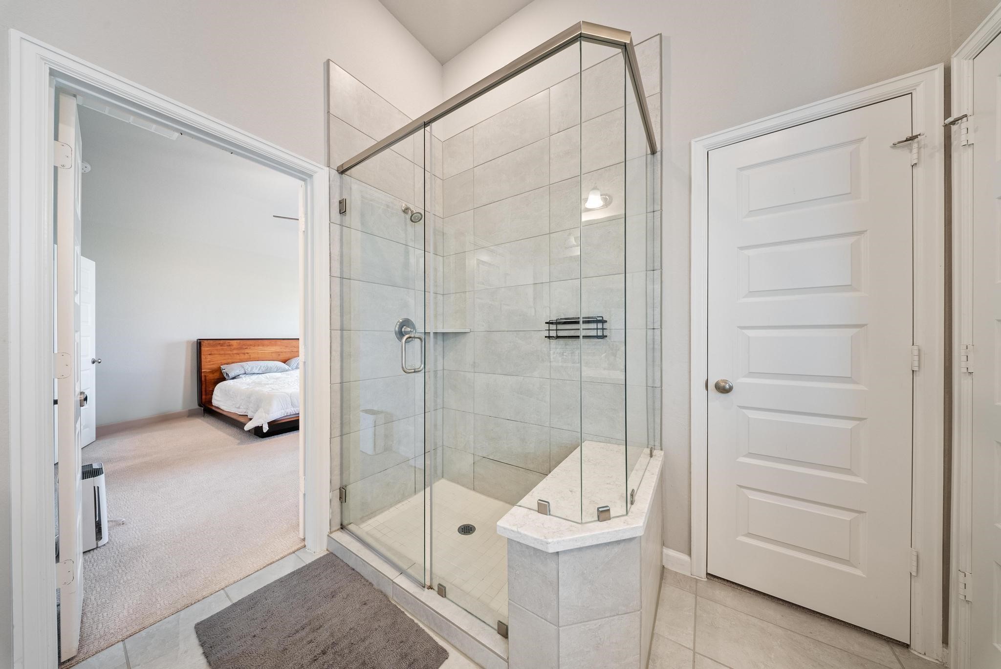10605 Centre Green Way Houston, TX 77043 - Photo 17 of 22 a room that has a glass shower door and a couch