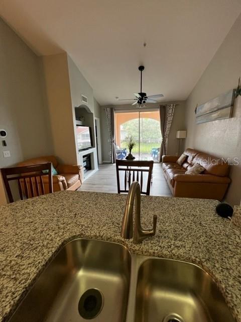 4170 Central Sarasota Parkway, Unit 428 Sarasota, FL 34238 - Photo 12 of 35 a view of a kitchen island with furniture and kitchen view