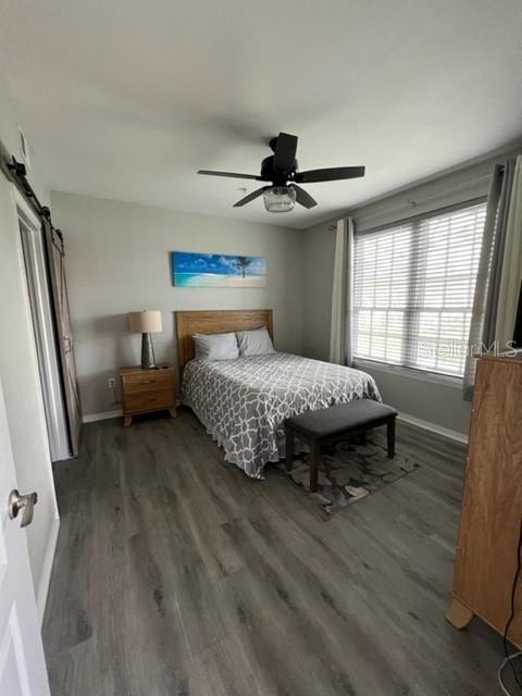 4170 Central Sarasota Parkway, Unit 428 Sarasota, FL 34238 - Photo 17 of 35 a bedroom with a bed and a window