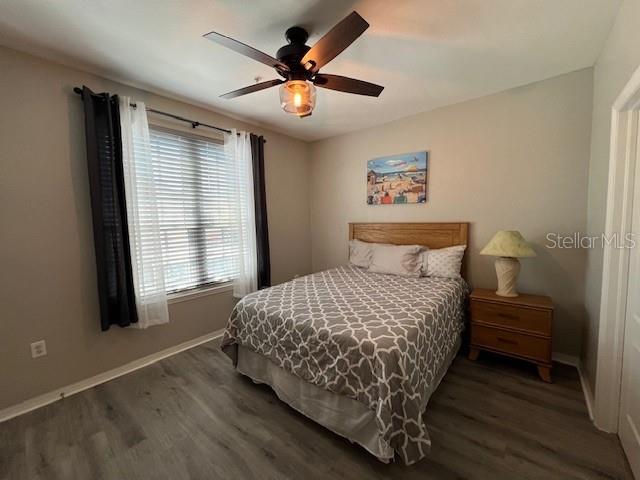 4170 Central Sarasota Parkway, Unit 428 Sarasota, FL 34238 - Photo 21 of 35 a bedroom with a bed and a window