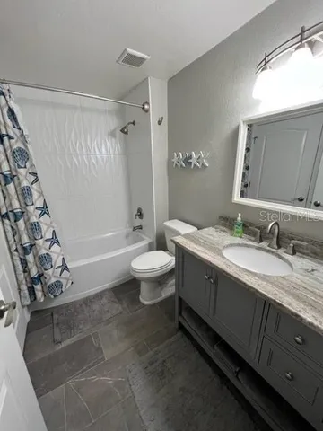 a bathroom with a tub and a shower