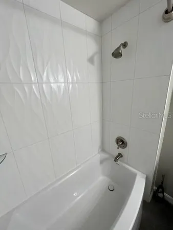 a living room with large trees and furniture