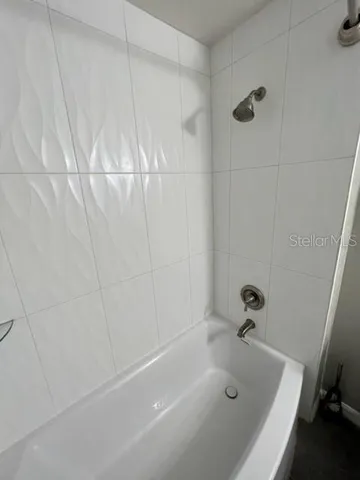 a living room with large trees and furniture