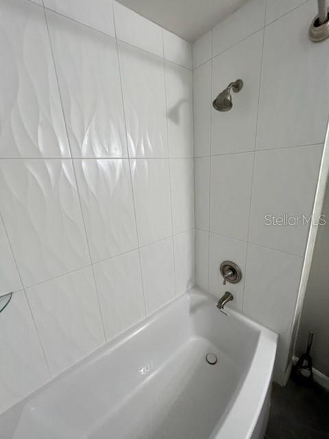 4170 Central Sarasota Parkway, Unit 428 Sarasota, FL 34238 - Photo 24 of 35 a bathroom with a tub and a shower