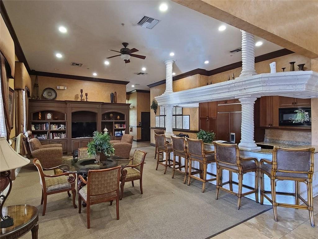 4170 Central Sarasota Parkway, Unit 428 Sarasota, FL 34238 - Photo 29 of 35 a view of a dining room with furniture