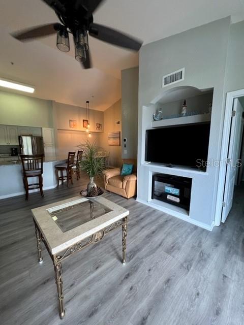 4170 Central Sarasota Parkway, Unit 428 Sarasota, FL 34238 - Photo 10 of 35 a living room with furniture and a flat screen tv