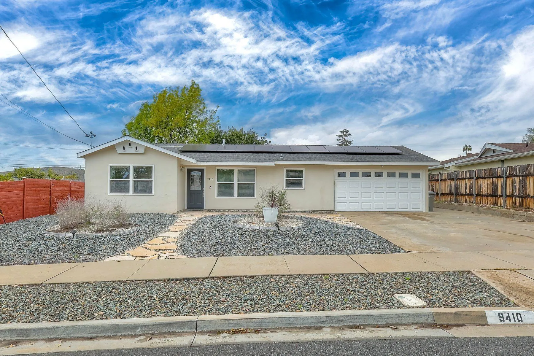 9410 Pike Road Santee, CA 92071 - Photo 1 of 25 a front view of a house with garden